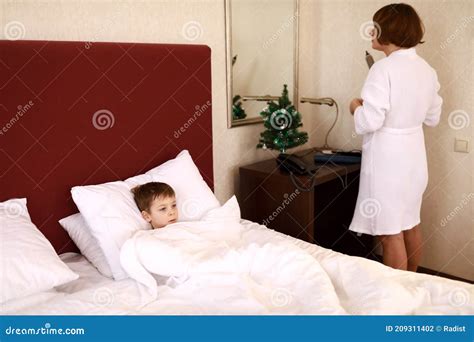 Step mommy and stepson share a bed in a hotel room